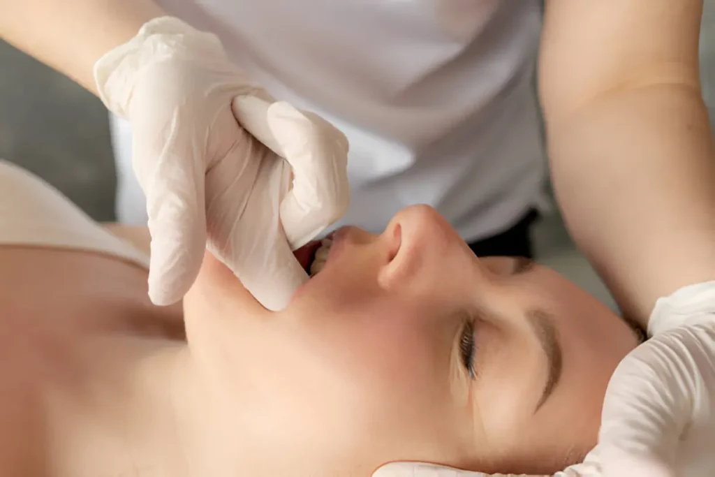 Person pressing hand pressure point to reduce toothache naturally